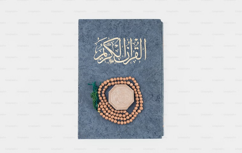a book with beads and a wooden bead on it