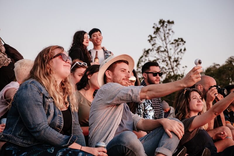 Man taking selfie while sitting